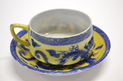 Lot 380A - A Chinese porcelain cup and saucer, the yellow...