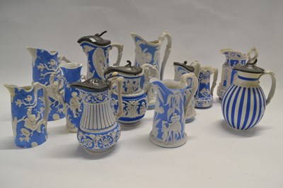 Lot 434 - A collection of mid 19th Century pottery jugs,...