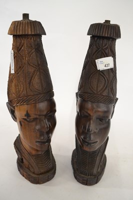 Lot 437 - A pair of carved wooden ethnic tribal heads...