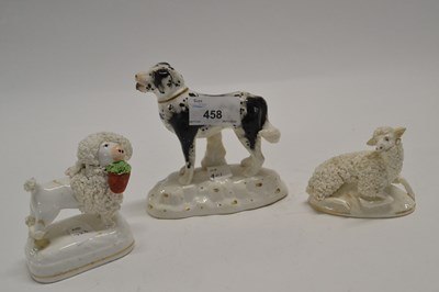 Lot 458 - An English porcelain model of a dog with black...