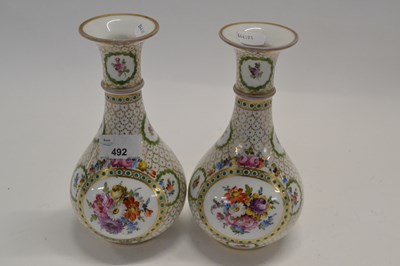 Lot 492 - A pair of French porcelain vases of baluster...