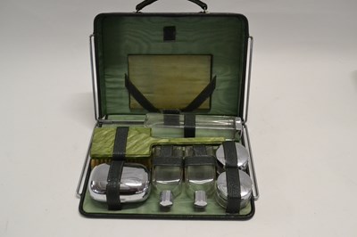 Lot 543 - A vanity case with various bottles and hair brush