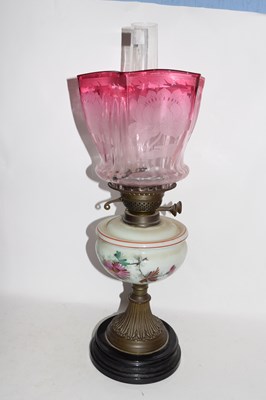 Lot 397 - Victorian oil lamp with cranberry tinted glass...