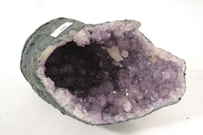 Lot 340 - An amethyst geode, approx. 35cm long