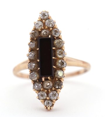 Lot 17 - An onyx and diamond ring, set to centre with a...