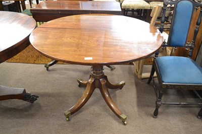 Lot 584 - Georgian mahogany circular table raised on a...