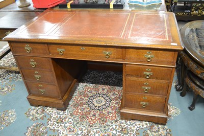 Lot 615 - A late Victorian oak twin pedestal desk with...