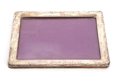 Lot 44 - A George V silver photograph frame of plain...