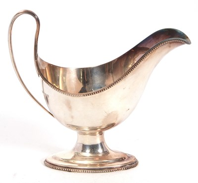 Lot 66 - A hallmarked silver pedestal sauce boat having...