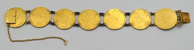 Lot 54 - Bracelet comprising of seven GRIII Gold...