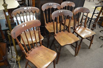 Lot 636 - A harlequin set of six elm seated kitchen...