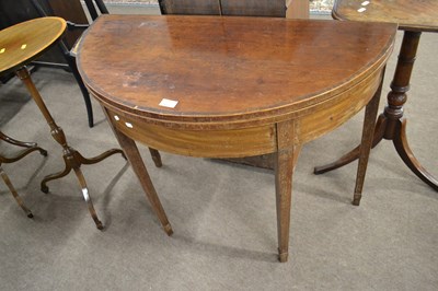 Lot 637 - A Georgian mahogany tea table of D shaped form...