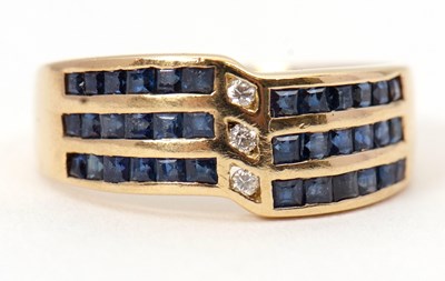 Lot 5 - A sapphire and diamond ring, set with three...