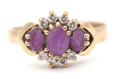 Lot 8 - A 9ct amethyst and diamond ring, the three...