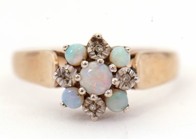 Lot 11 - A 9ct opal and diamond ring, set with a...