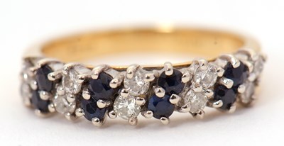 Lot 13 - An 18ct sapphire and diamond ring, set with 9...