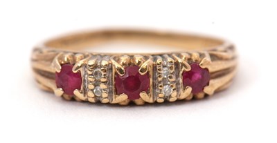 Lot 48 - A 9ct ruby and diamond ring, the three round...