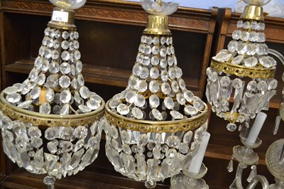 Lot 676 - A pair of cut clear glass and metal mounted...