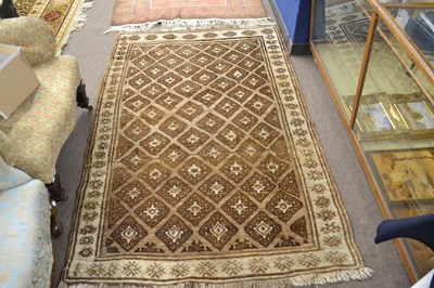 Lot 692 - A small Middle Eastern wool floor rug with...