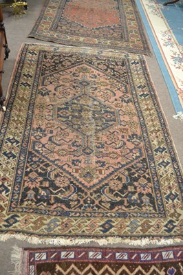 Lot 696 - An antique Middle Eastern wool floor rug with...