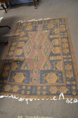 Lot 698 - A Middle Eastern shallow pile floor rug with...