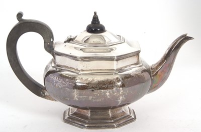 Lot 128 - A George V silver teapot of plain octagonal...