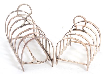 Lot 141 - Two lancet formed toast racks, a George V six...