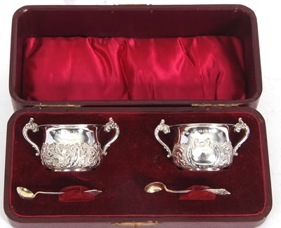 Lot 148 - A cased pair of silver twin handle salts with...