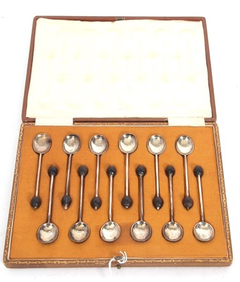 Lot 150 - cased  twelve silver bean end coffee spoons,...