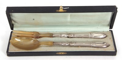 Lot 152 - A cased pair of French silver plated handled...