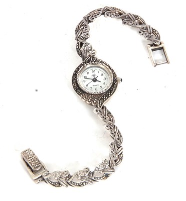 Lot 232 - A white metal lady's quartz wristwatch, case...