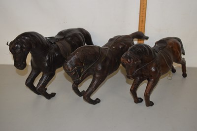 Lot 1 - Three vintage leather covered model horses