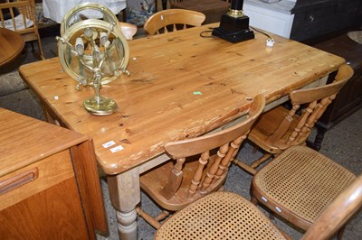 Lot 284 - A modern pine rectangular kitchen table on...