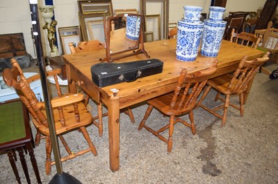 Lot 303 - A rectangular pine kitchen table with six...