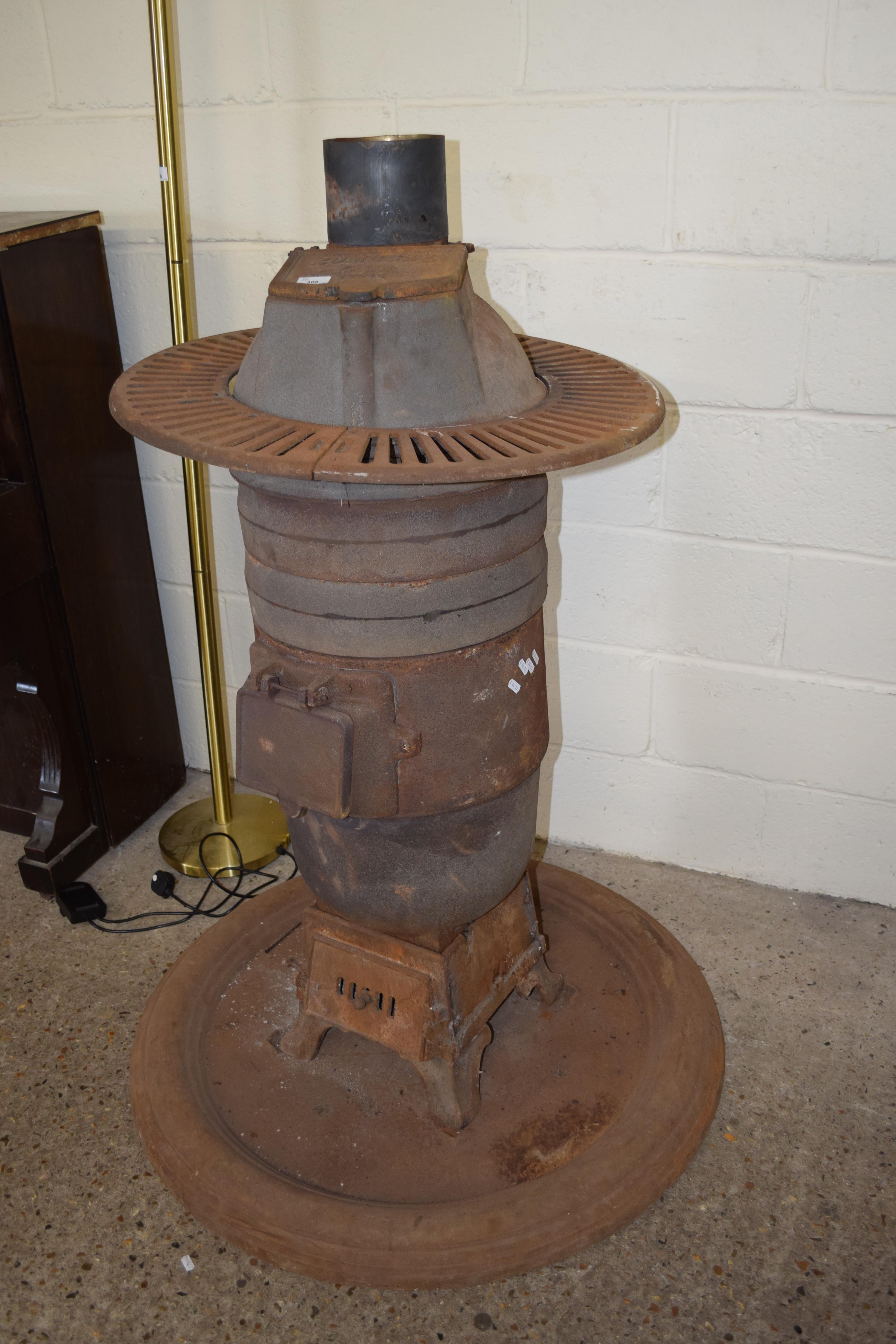 Lot 308 LARGE ROMESSE CAST IRON STOVE WITH CIRCULAR