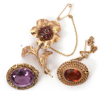 Lot 106 - Three gemset brooches: to include an oval...