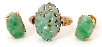 Lot 153 - A jade ring and earrings: the ring set with a...