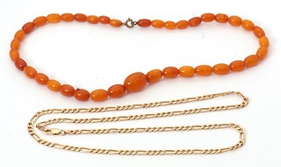 Lot 169 - An amber bead necklace and a gold plated...