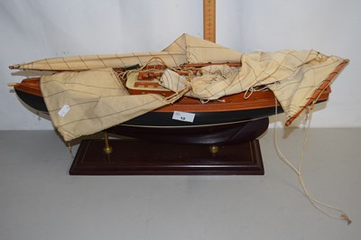 Lot 10 - Model boat on stand with sails