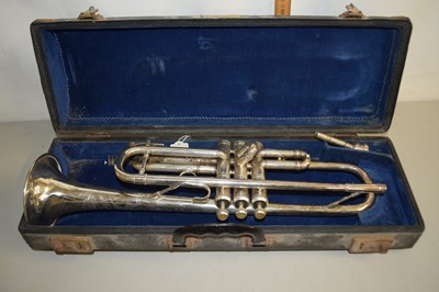 Lot 17 - A cased trumpet marked Emo Champion