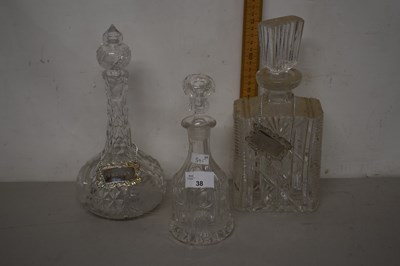 Lot 38 - Three decanters, two with plated labels for...