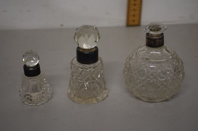 Lot 77 - Group of three scent bottles with silver rims