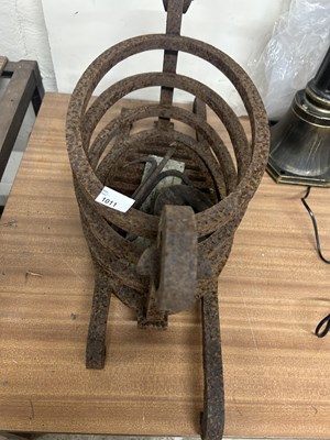 Lot 1011 - An unusual cast iron fire basket