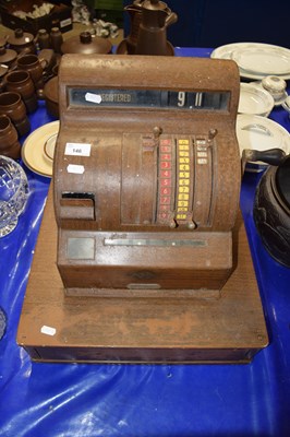 Lot 146 - A vintage National Cash Register in wood grain...