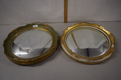 Lot 166 - Two convex porthole style mirrors in gilt...