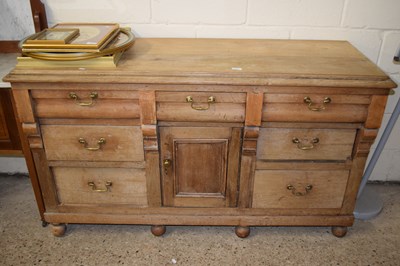 Lot 210 - Victorian pine dresser base with seven drawers...