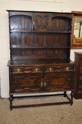 Lot 211 - An early 20th Century oak dresser with two...