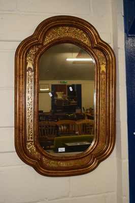 Lot 217 - A modern wall mirror in gilt and leather...