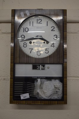 Lot 227 - A retro Seiko time dater wall clock