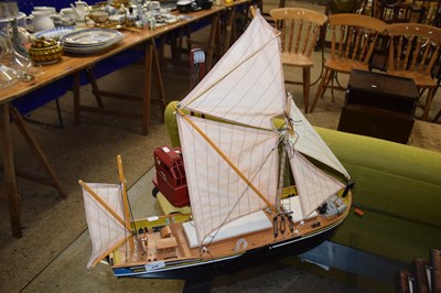 Lot 239 - A model boat and a vintage tin plate Jones toy...